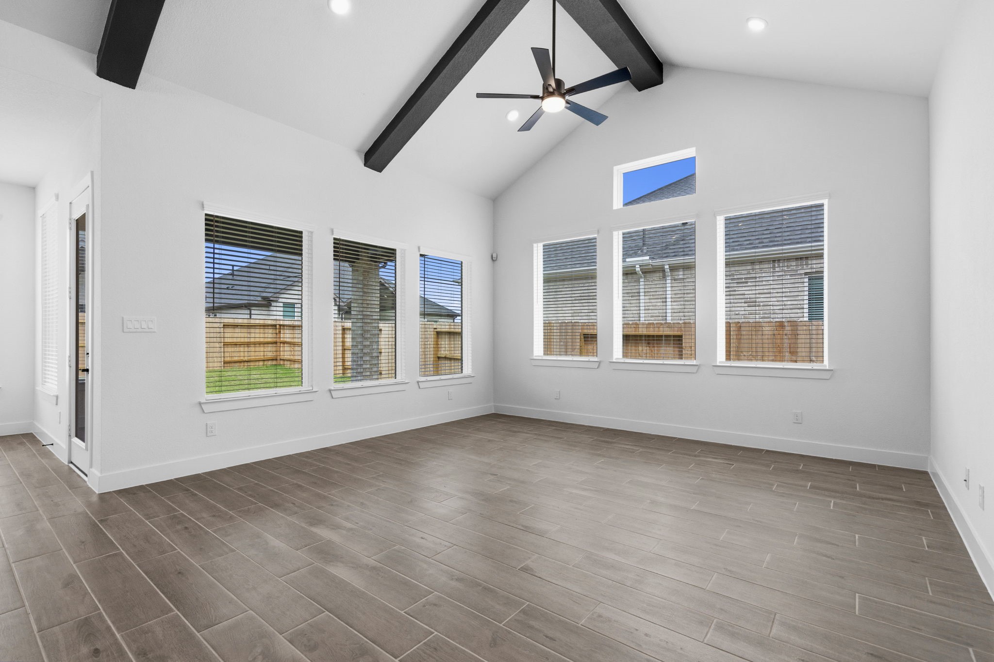 633 Cross Timbers Trace Waller, TX 77484 - Photo 11 of 42 a view of an empty room with a window and wooden floor