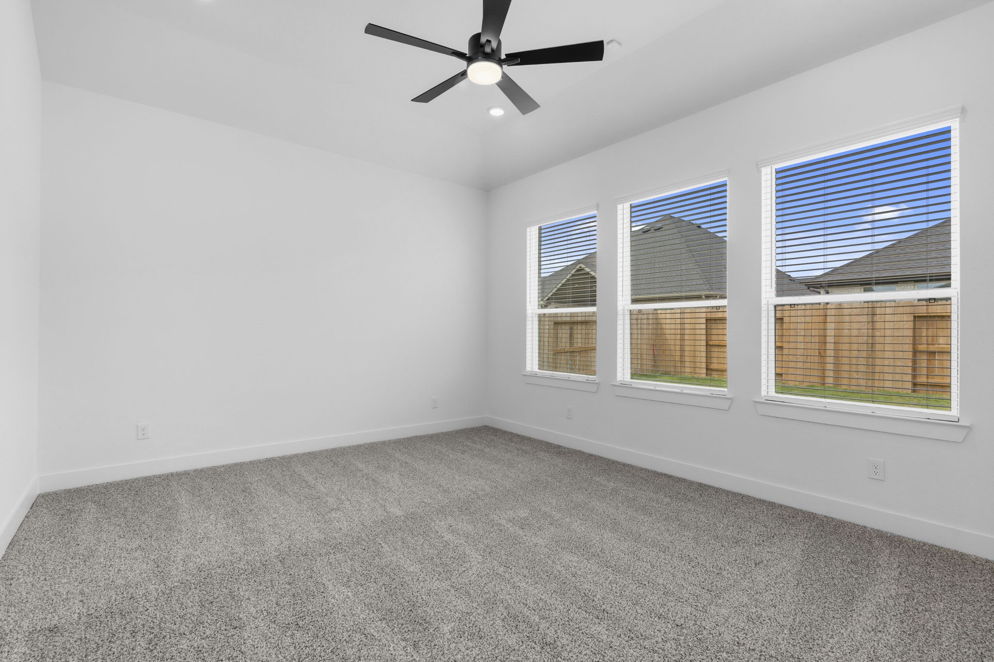 633 Cross Timbers Trace Waller, TX 77484 - Photo 12 of 42 an empty room with a window and ceiling fan