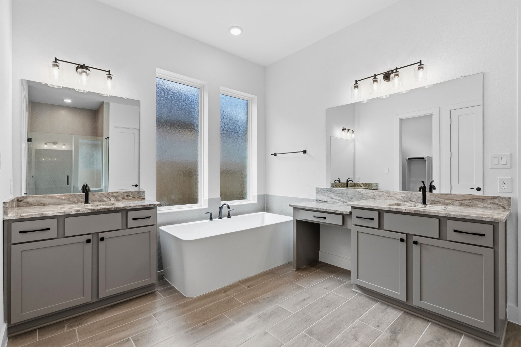 633 Cross Timbers Trace Waller, TX 77484 - Photo 14 of 42 a large bathroom with a double vanity sink mirror and double