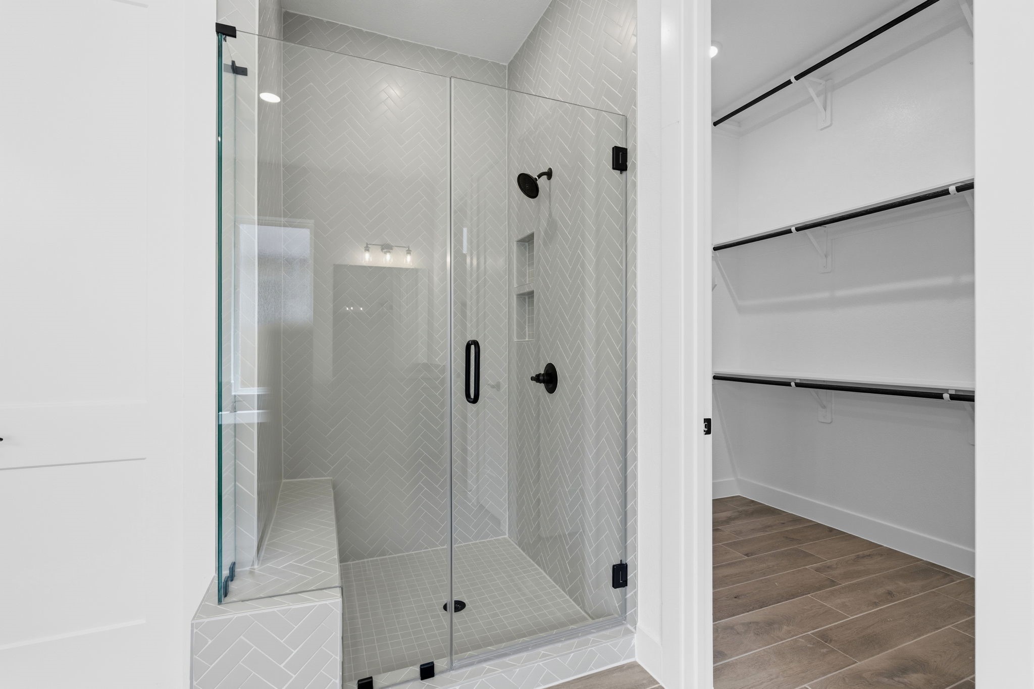 633 Cross Timbers Trace Waller, TX 77484 - Photo 15 of 42 a bathroom with a glass shower door