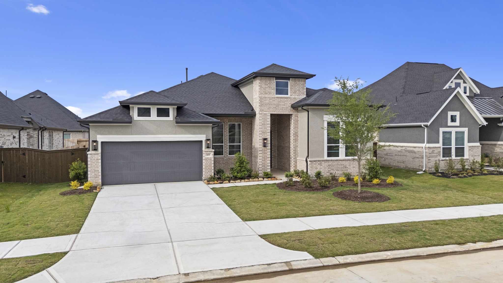 633 Cross Timbers Trace Waller, TX 77484 - Photo 2 of 42 a front view of a house with a yard and garage