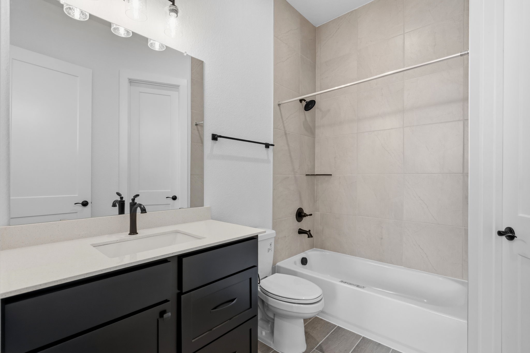 633 Cross Timbers Trace Waller, TX 77484 - Photo 25 of 42 a bathroom with a sink a toilet and shower