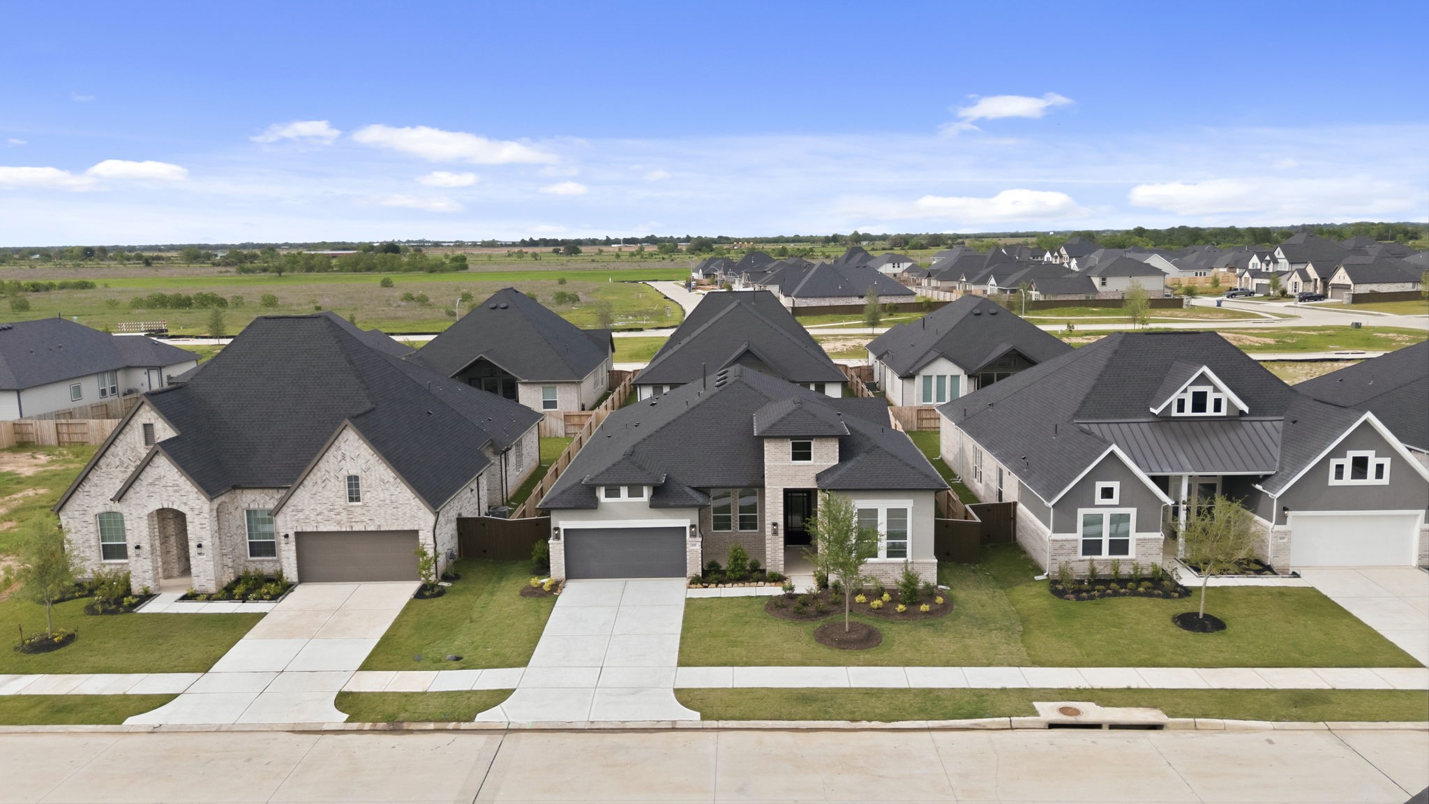 633 Cross Timbers Trace Waller, TX 77484 - Photo 35 of 42 an aerial view of residential houses with outdoor space and ocean view