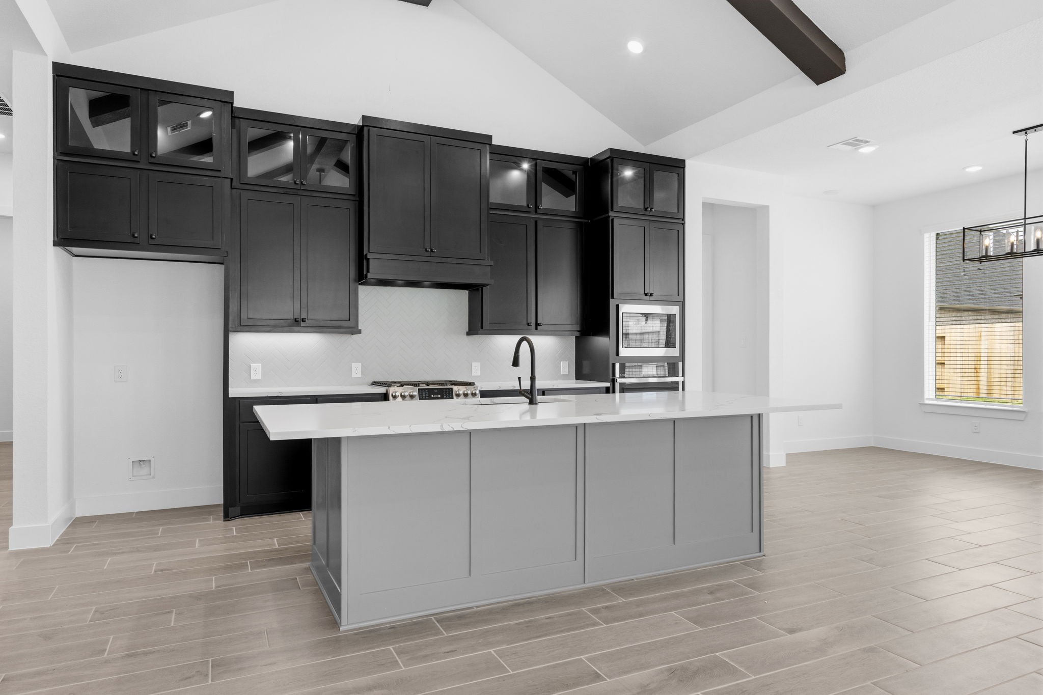 633 Cross Timbers Trace Waller, TX 77484 - Photo 5 of 42 a kitchen with stainless steel appliances a sink and cabinets