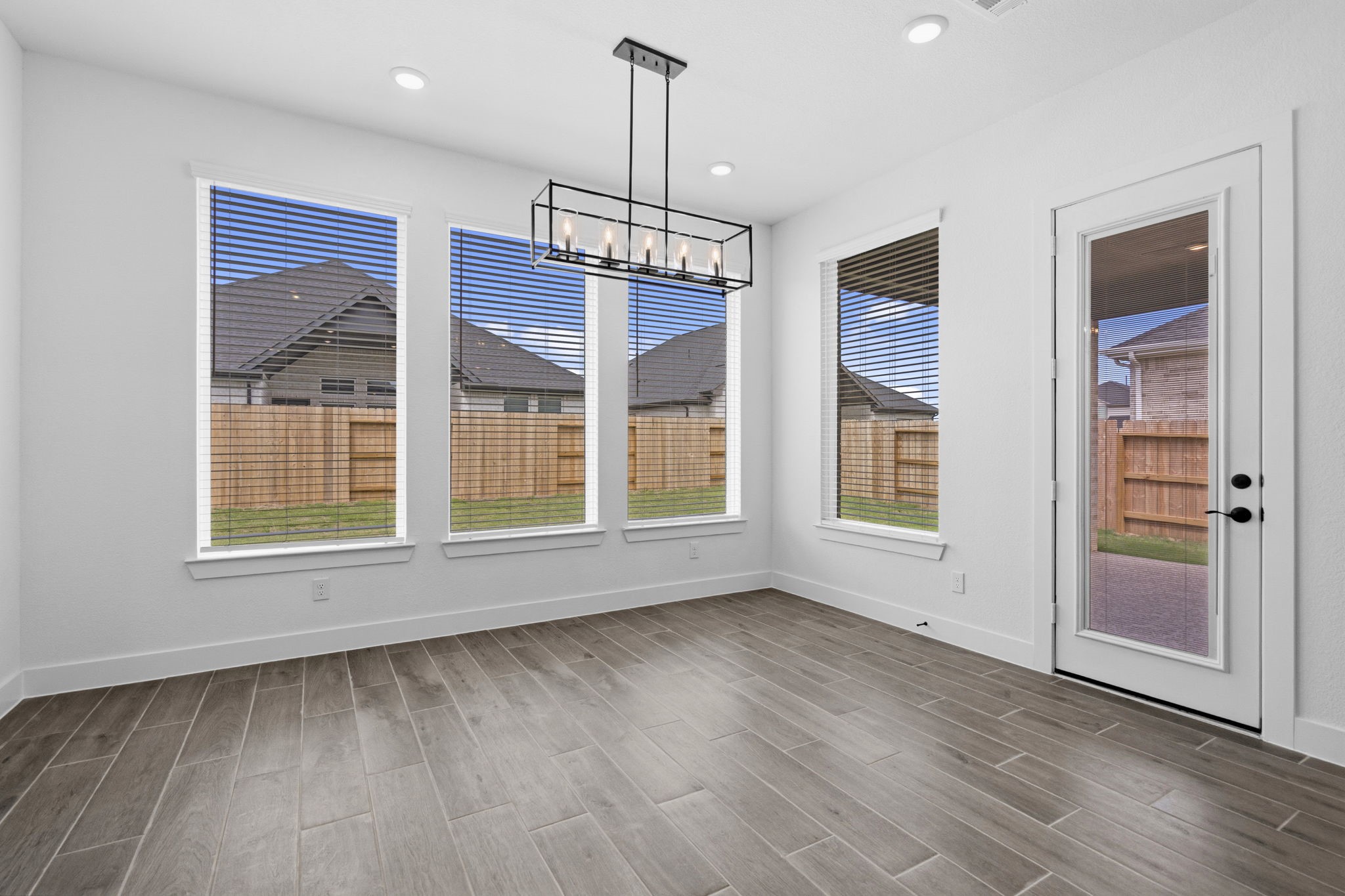 633 Cross Timbers Trace Waller, TX 77484 - Photo 8 of 42 a view of an empty room with a window and wooden floor