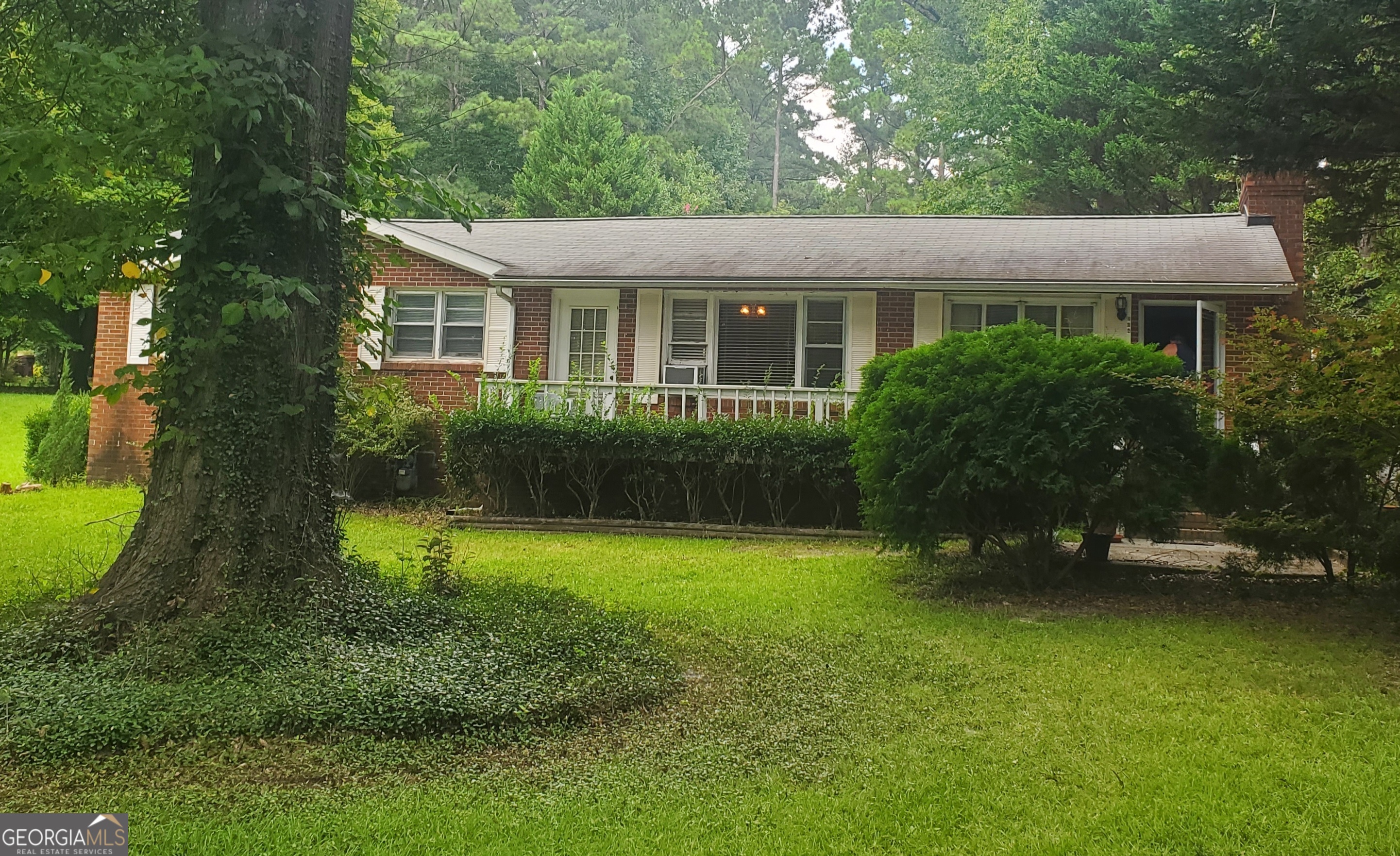544 McDonough Road Hampton, GA 30228 - Photo 1 of 1 a view of a house with a garden