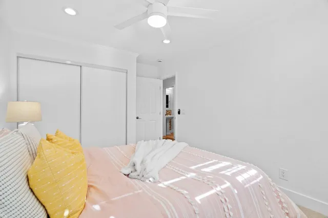 a bedroom with bed and a window