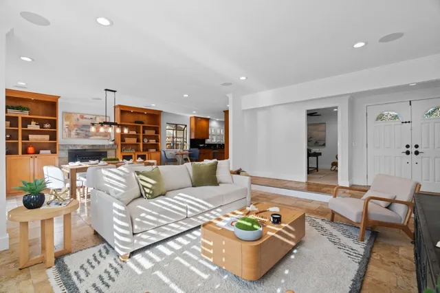 a living room with furniture and a table