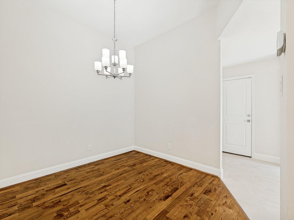 4010 Rive Lane Addison, TX 75001 - Photo 15 of 25 a view of a room with wooden floor and ceiling fan