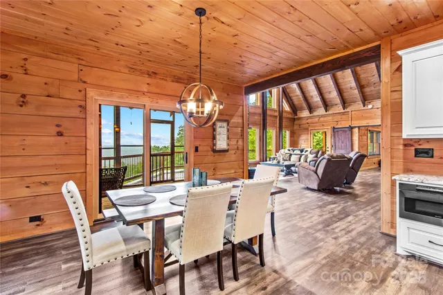 a view of a dining room with furniture water and chandelier
