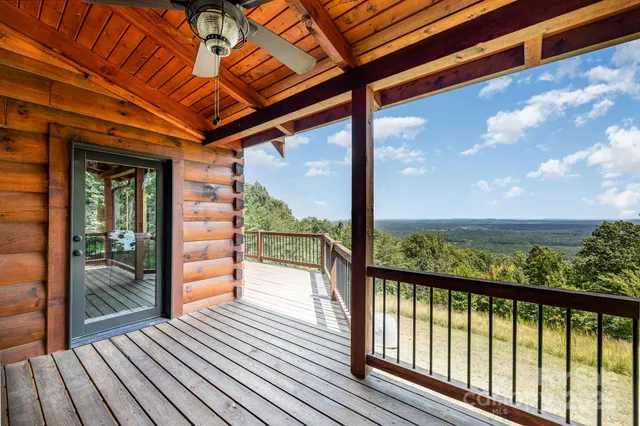 a view of a balcony with wooden floor