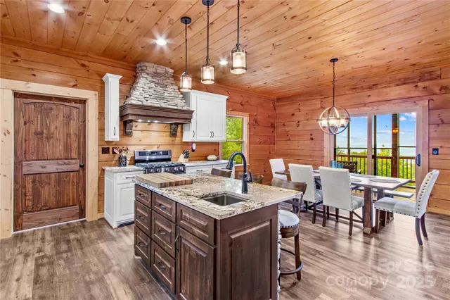 a kitchen with a sink stove and wooden cabinets