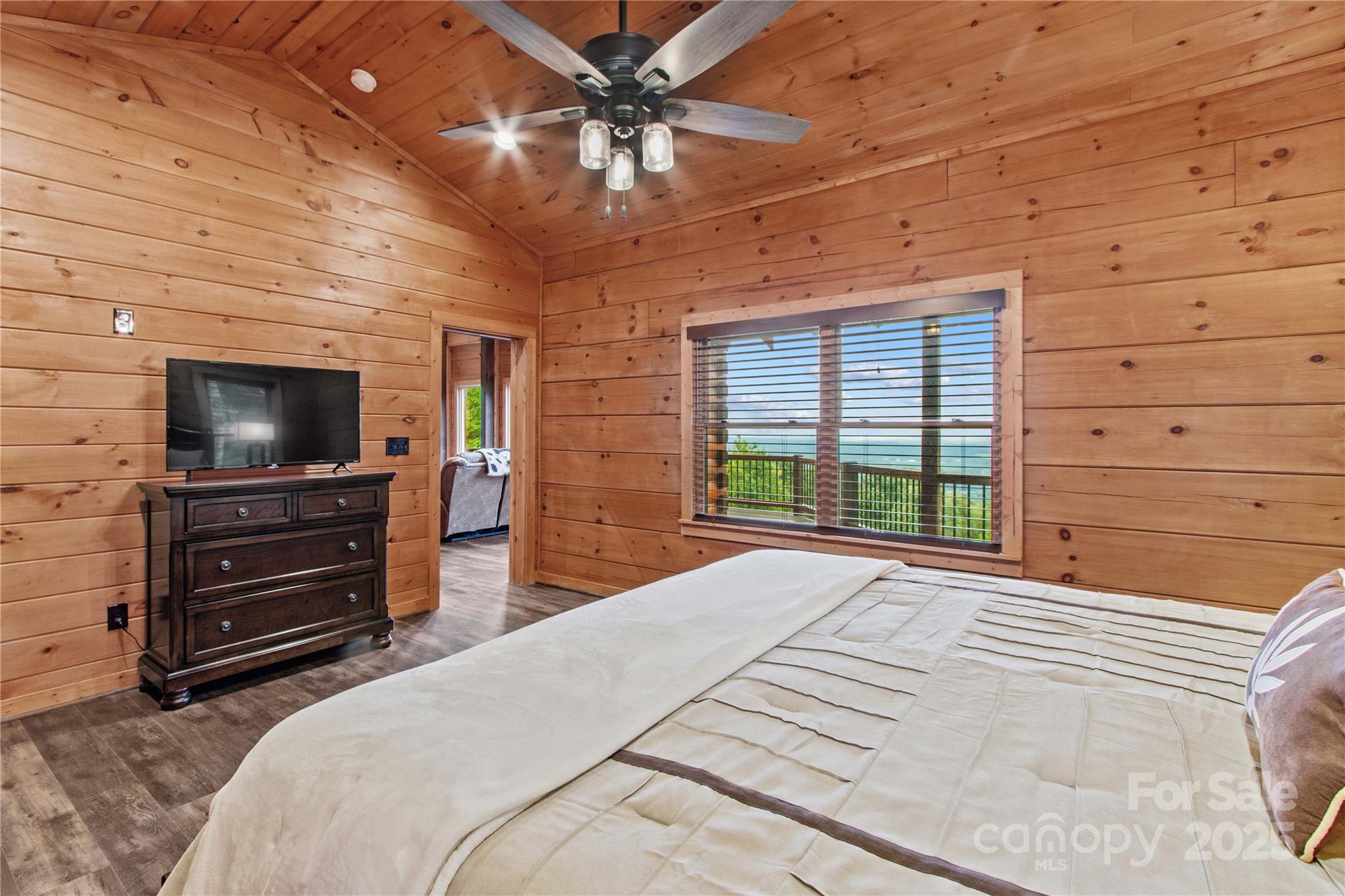 1220 Sierra Trace Road Denton, NC 27239 - Photo 25 of 48 a bedroom with a bed and a flat screen tv