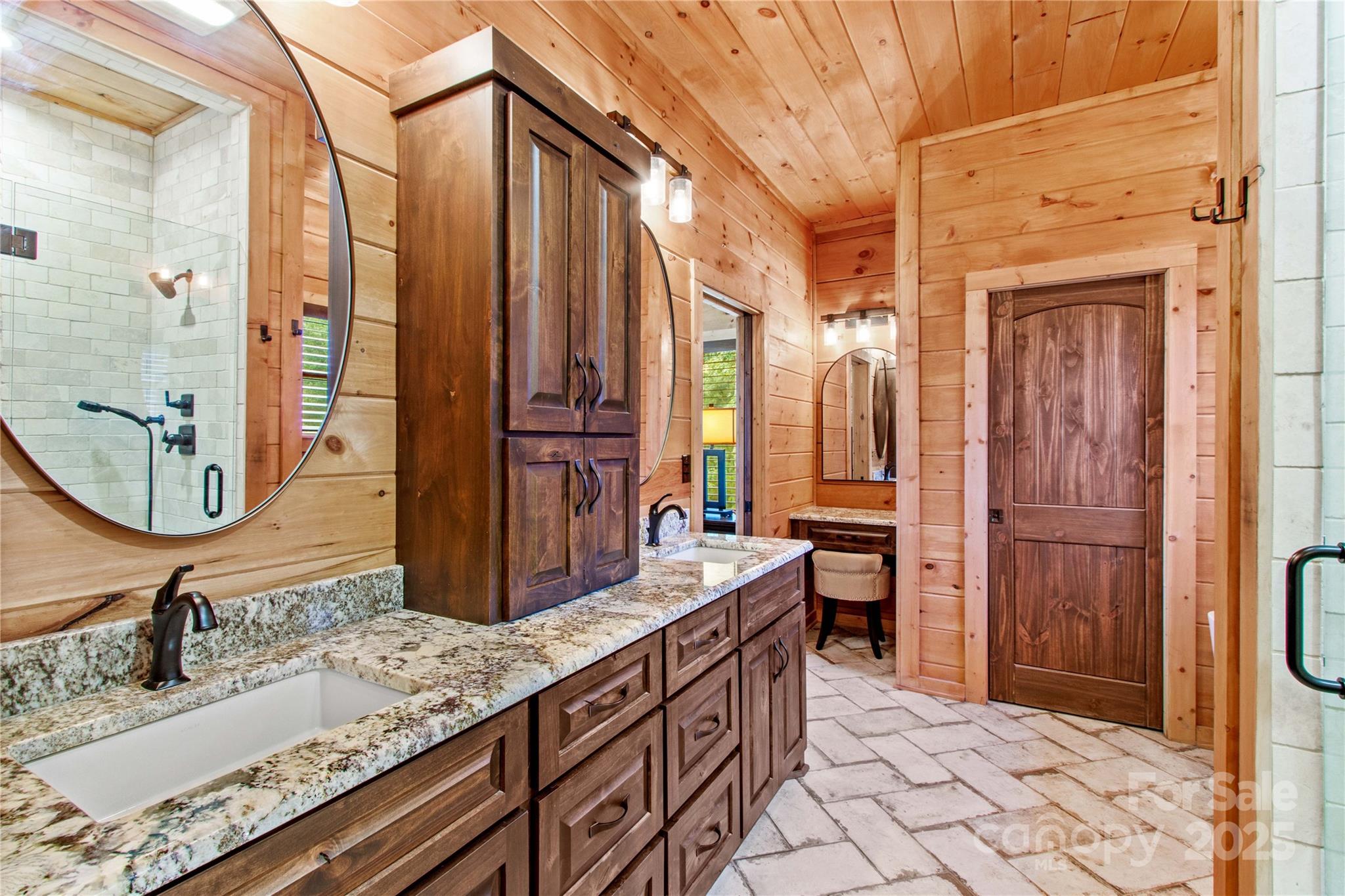 1220 Sierra Trace Road Denton, NC 27239 - Photo 26 of 48 a bathroom with a granite countertop sink and a mirror