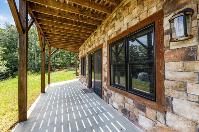 a view of a porch with wooden floor and outdoor space