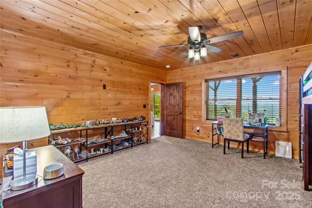 a living room with furniture a flat screen tv and a table