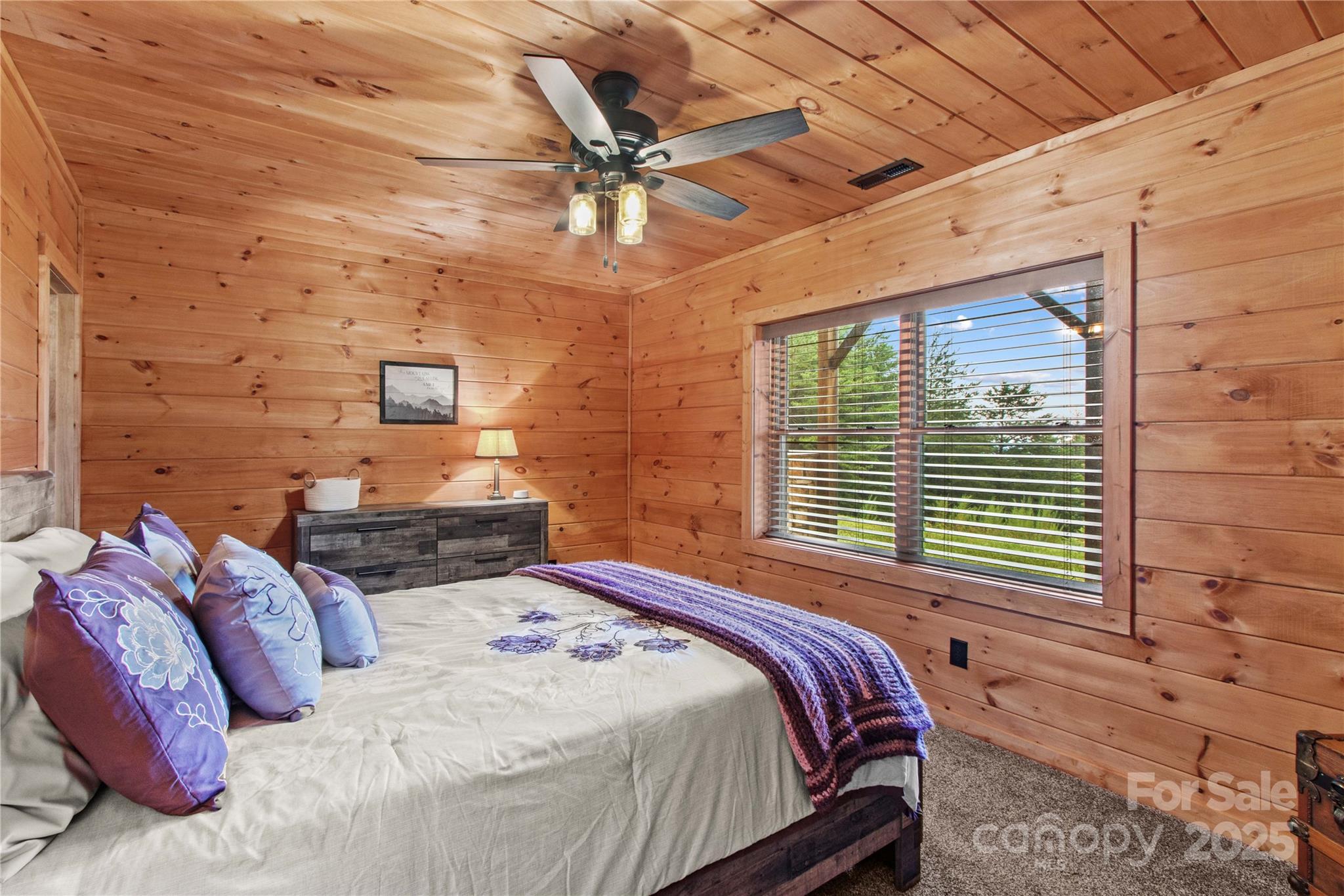 1220 Sierra Trace Road Denton, NC 27239 - Photo 36 of 48 a bedroom with a bed and ceiling fan