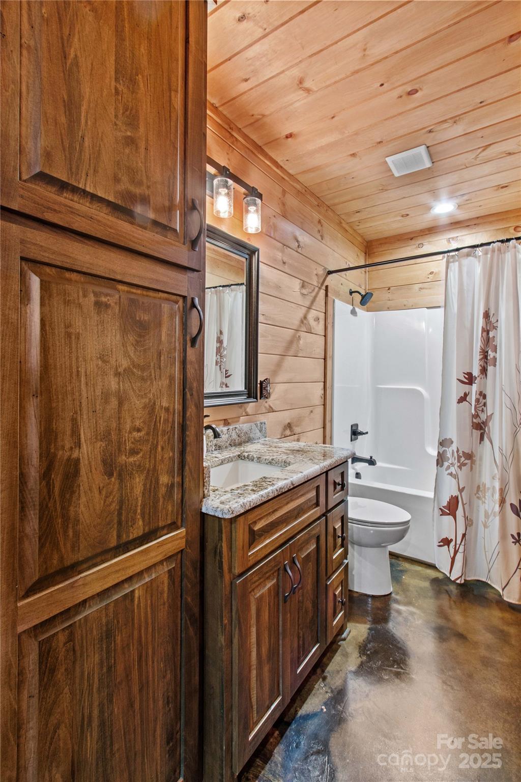 1220 Sierra Trace Road Denton, NC 27239 - Photo 37 of 48 a bathroom with a granite countertop sink toilet and shower