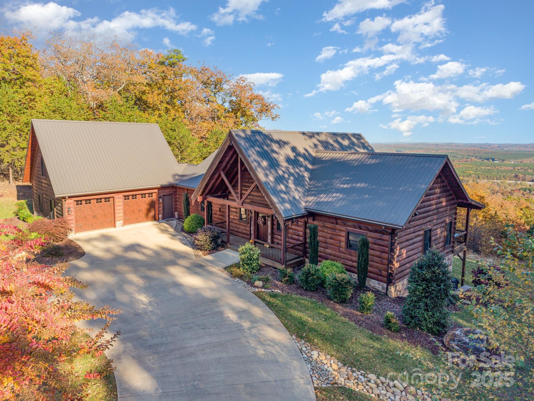 1220 Sierra Trace Road Denton, NC 27239 - Photo 5 of 48 a view of a big house with a big yard and potted plants