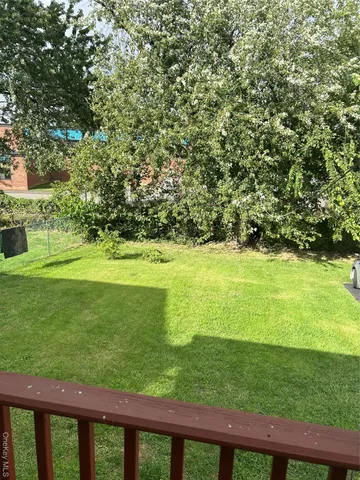 a view of a house with a yard and sitting space