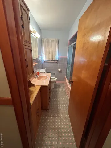 a bathroom with a sink a bathtub and shower