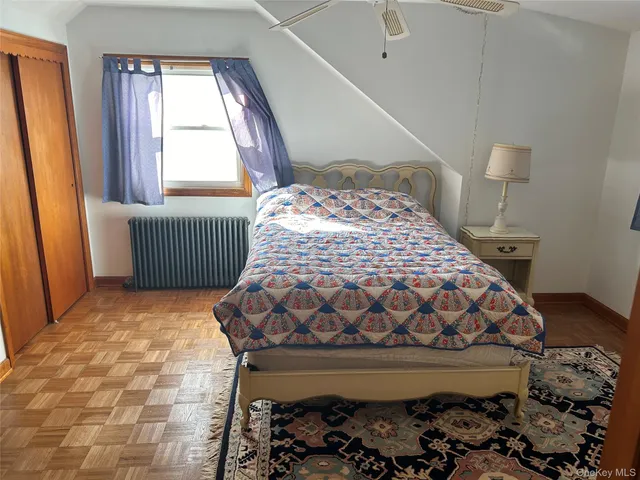 a living room with furniture rug and wooden floor