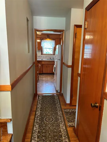 a kitchen with a table chairs sink and window