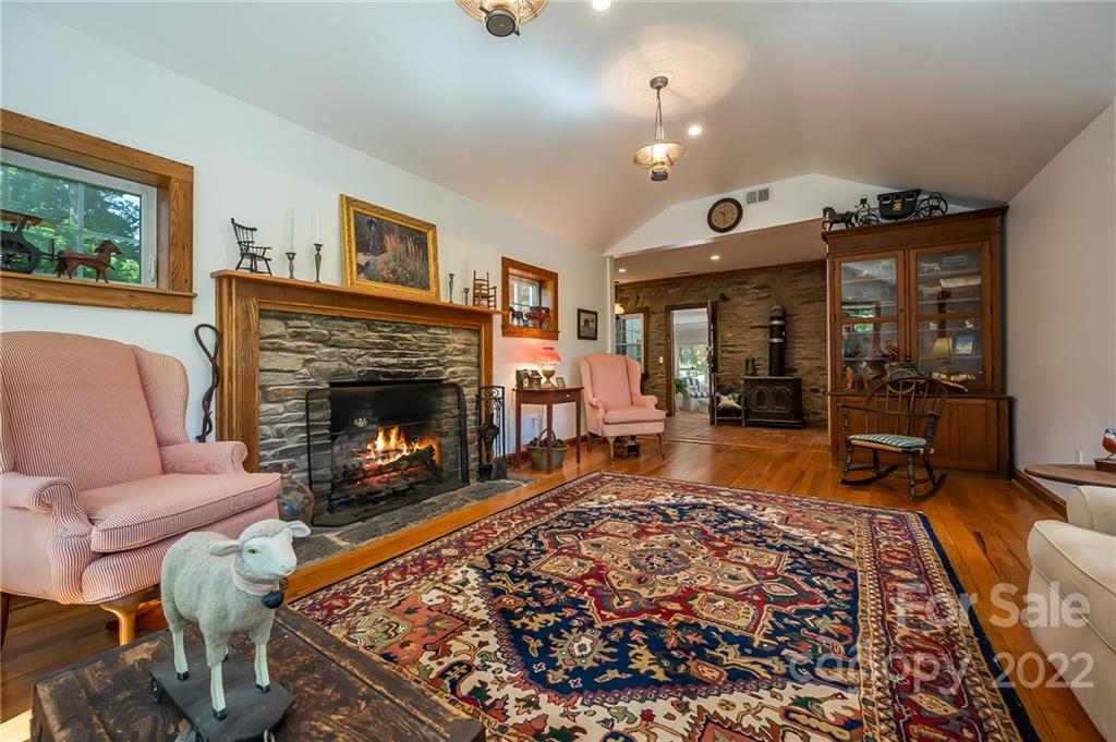 146 Hidden Hill Road Tryon, NC 28782 - Photo 13 of 43 a living room with furniture and a fireplace