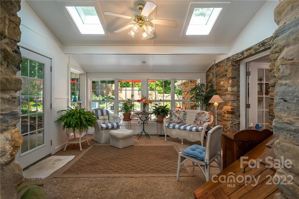146 Hidden Hill Road Tryon, NC 28782 - Photo 14 of 43 a living room with furniture and a large window