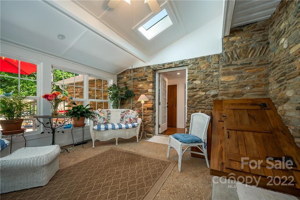 146 Hidden Hill Road Tryon, NC 28782 - Photo 15 of 43 a living room with furniture and a fireplace