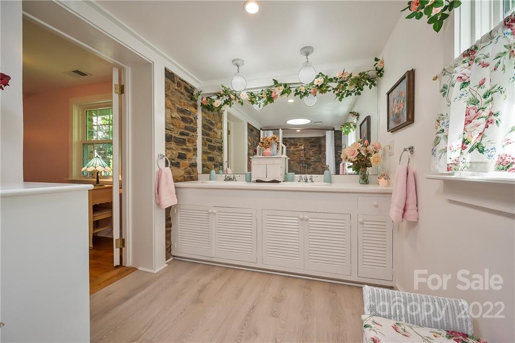 146 Hidden Hill Road Tryon, NC 28782 - Photo 21 of 43 a bathroom with a sink vanity and mirror