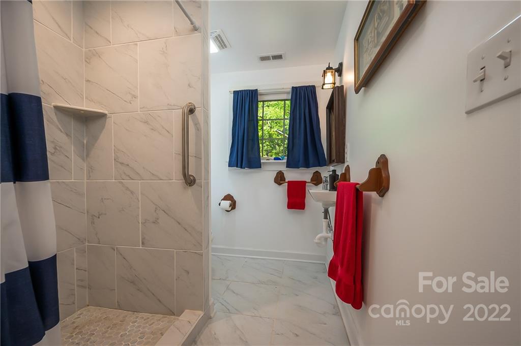 146 Hidden Hill Road Tryon, NC 28782 - Photo 25 of 43 a bathroom with a shower