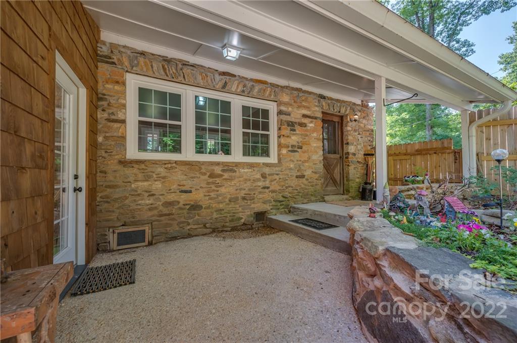 146 Hidden Hill Road Tryon, NC 28782 - Photo 27 of 43 a view of a house with a yard