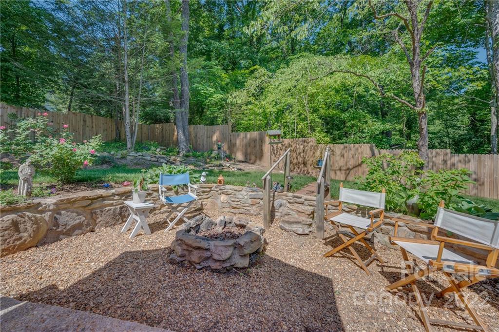146 Hidden Hill Road Tryon, NC 28782 - Photo 29 of 43 a view of a backyard with sitting area