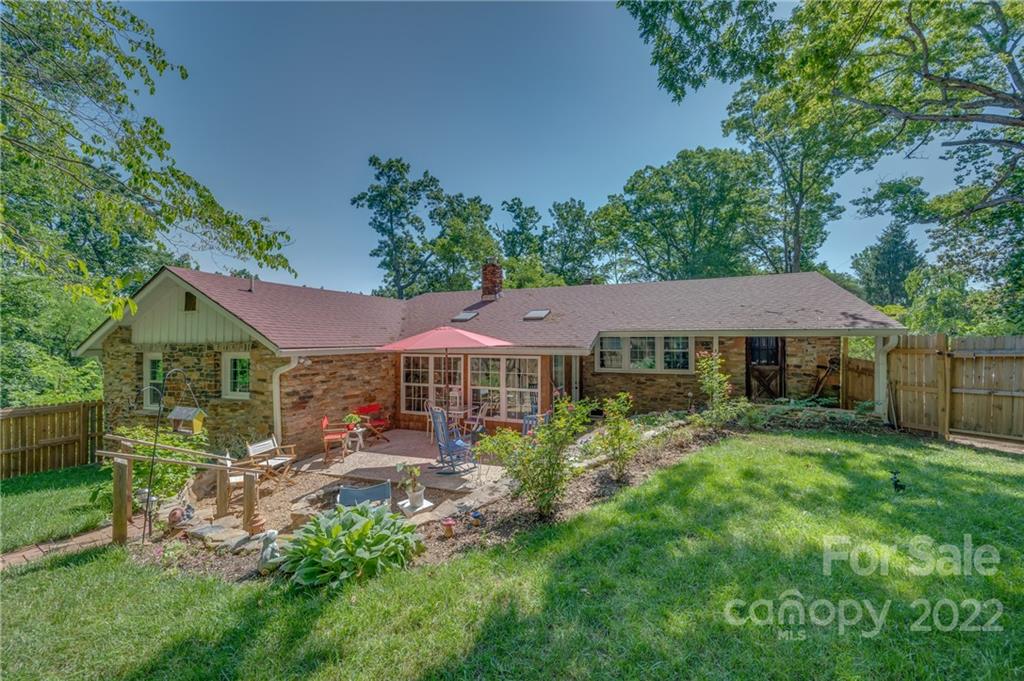 146 Hidden Hill Road Tryon, NC 28782 - Photo 30 of 43 a view of a house with a big yard and potted plants