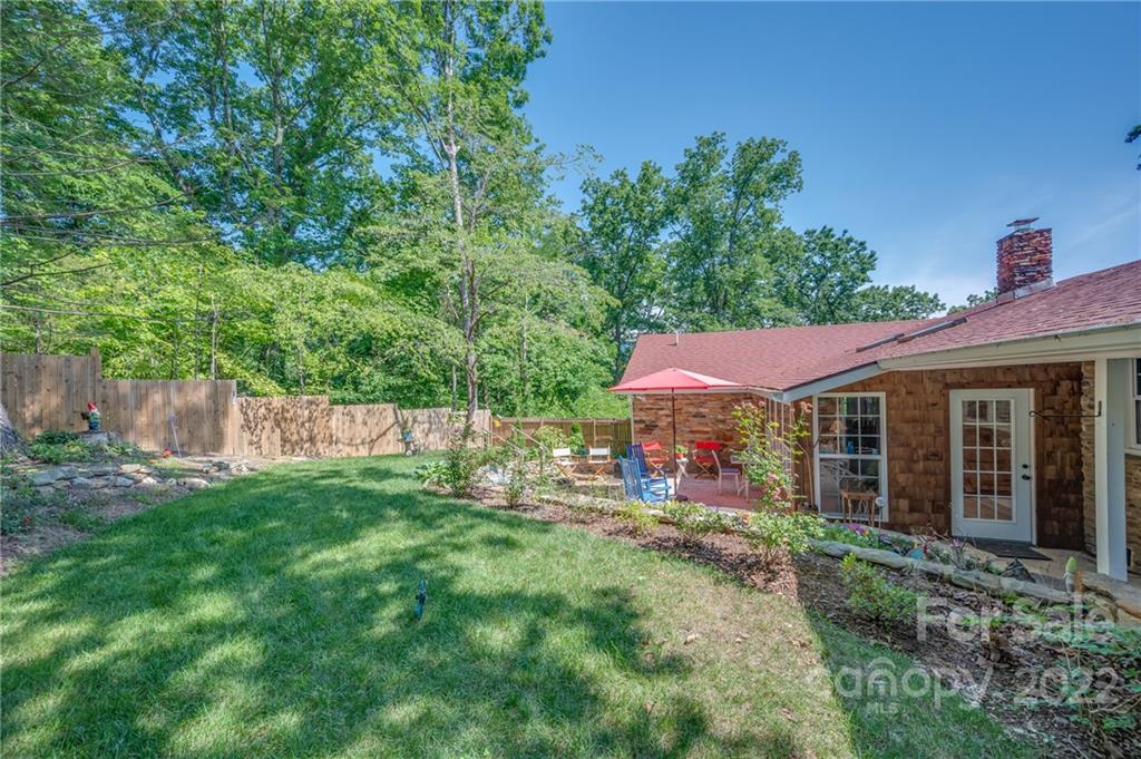 146 Hidden Hill Road Tryon, NC 28782 - Photo 32 of 43 a view of a house with a yard and sitting area