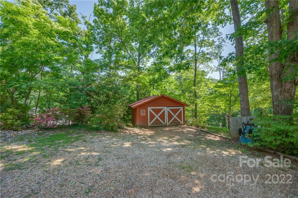 146 Hidden Hill Road Tryon, NC 28782 - Photo 34 of 43 a view of a house with a yard