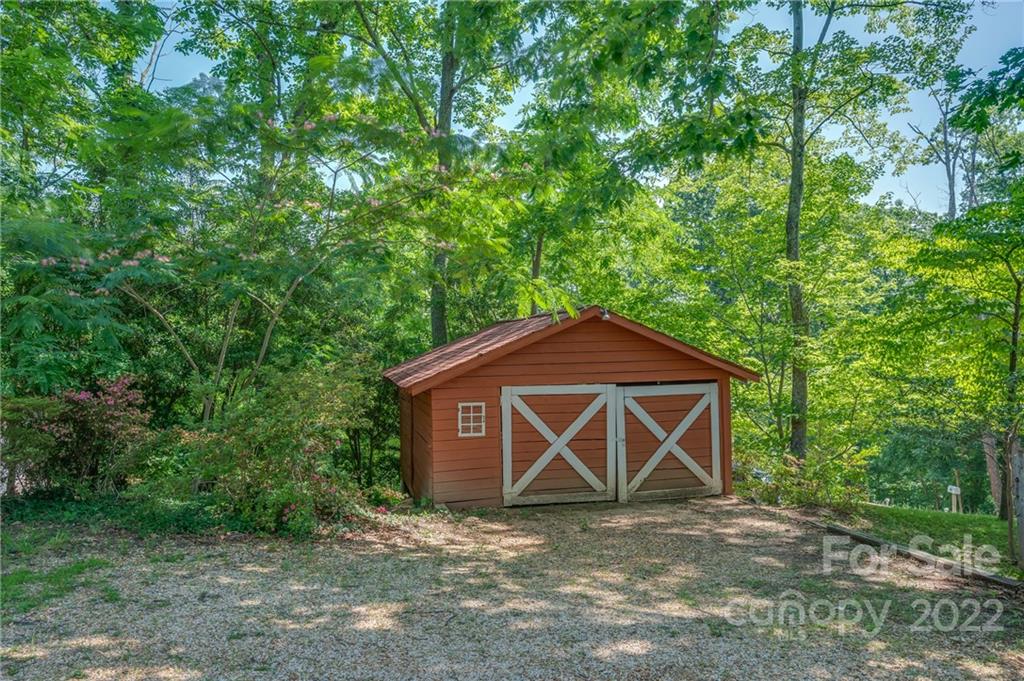 146 Hidden Hill Road Tryon, NC 28782 - Photo 35 of 43 a front view of a house with garden