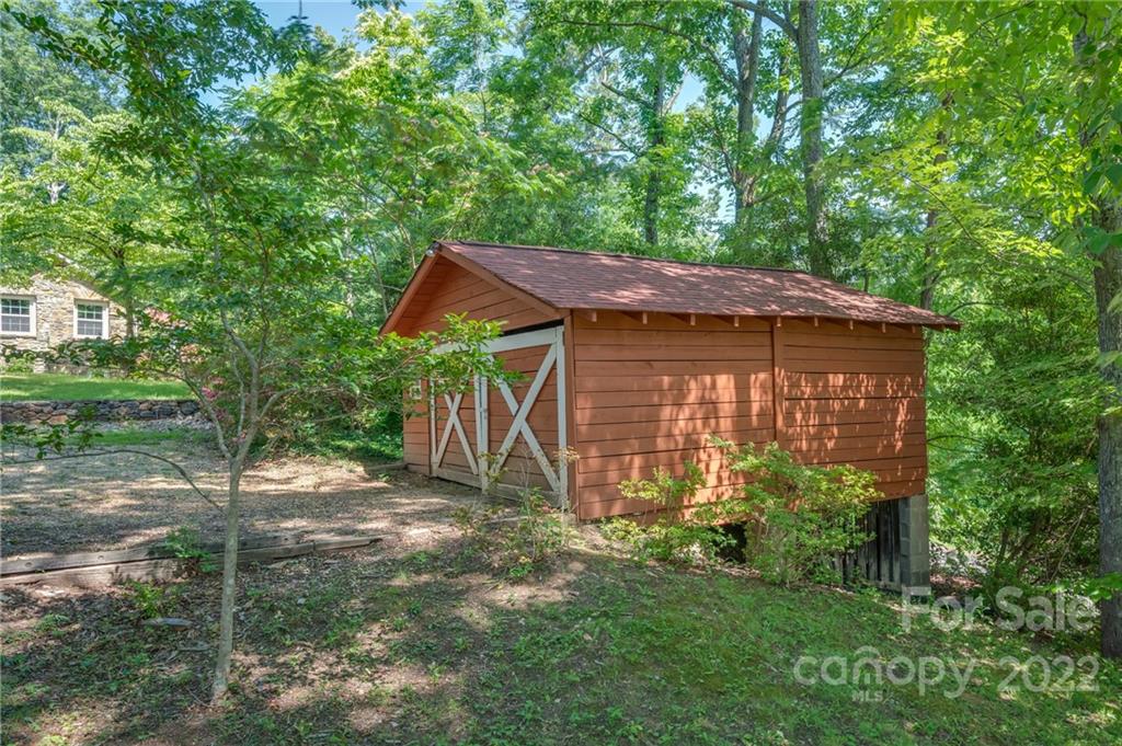 146 Hidden Hill Road Tryon, NC 28782 - Photo 39 of 43 a view of a house with a yard