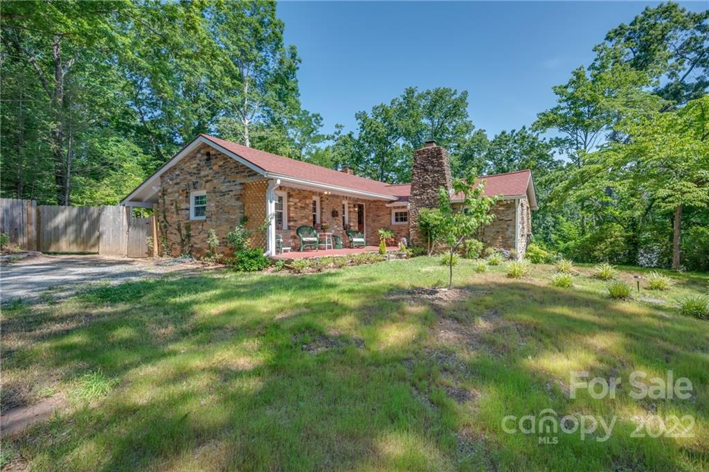 146 Hidden Hill Road Tryon, NC 28782 - Photo 41 of 43 a view of house with a yard