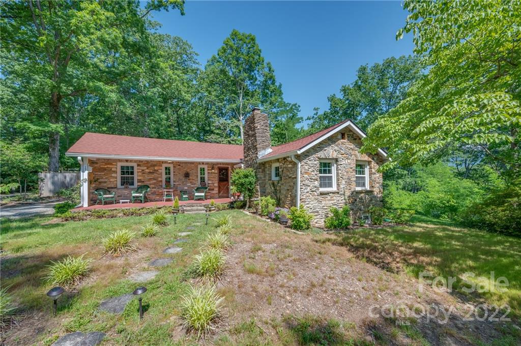 146 Hidden Hill Road Tryon, NC 28782 - Photo 42 of 43 a front view of a house with yard