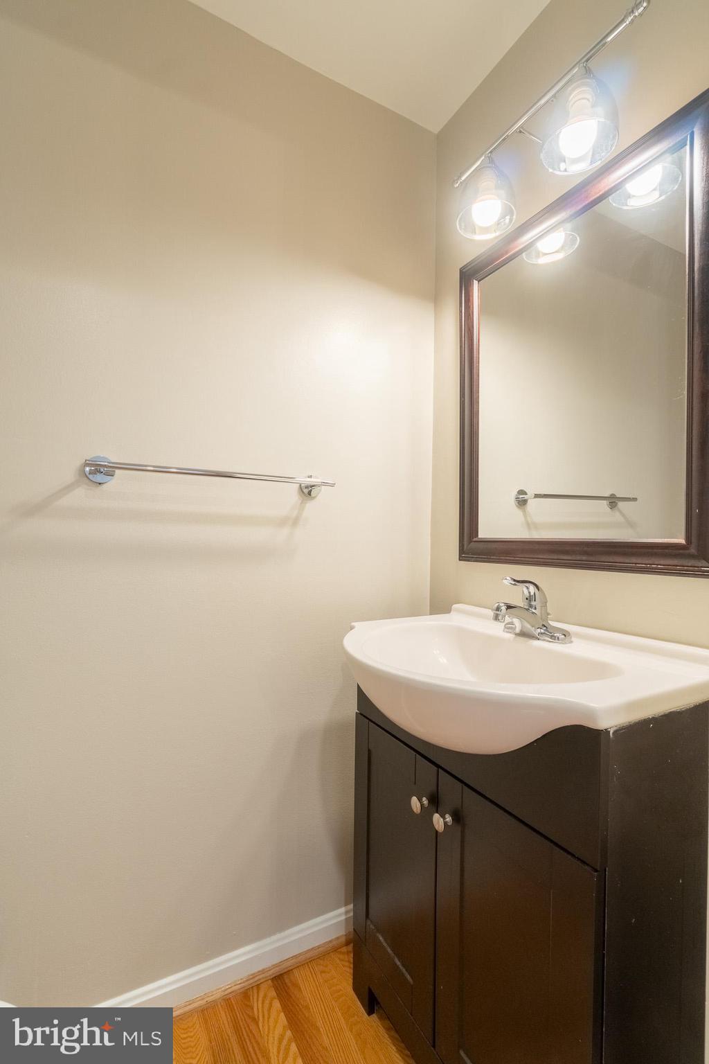 6754 Towne Lane Road McLean, VA 22101 - Photo 22 of 33 a bathroom with a sink and a mirror