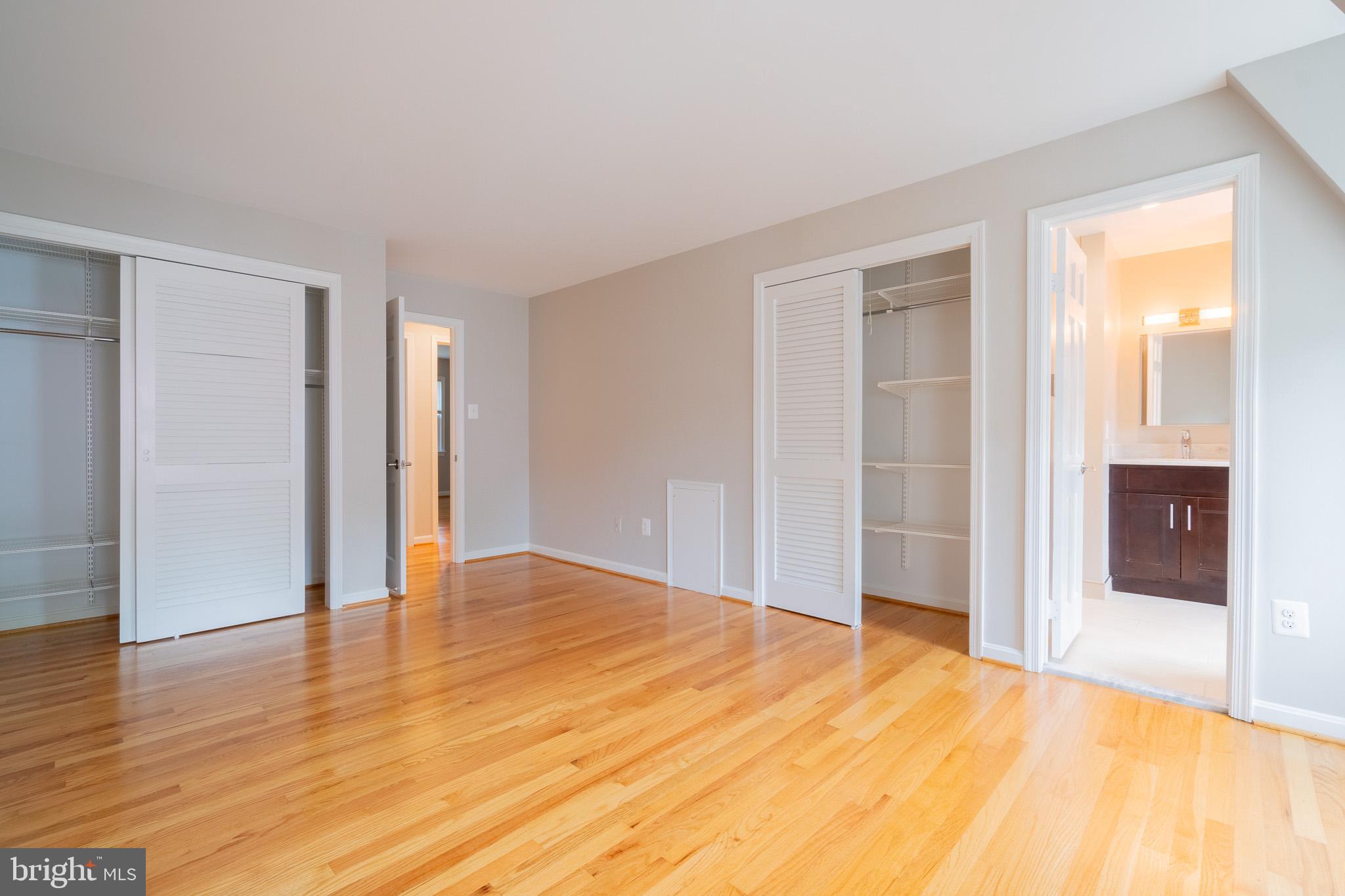 6754 Towne Lane Road McLean, VA 22101 - Photo 29 of 33 a view of an empty room with wooden floor and a window