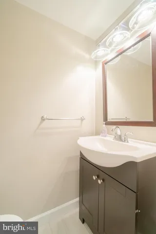 a bathroom with a sink a mirror and a shower