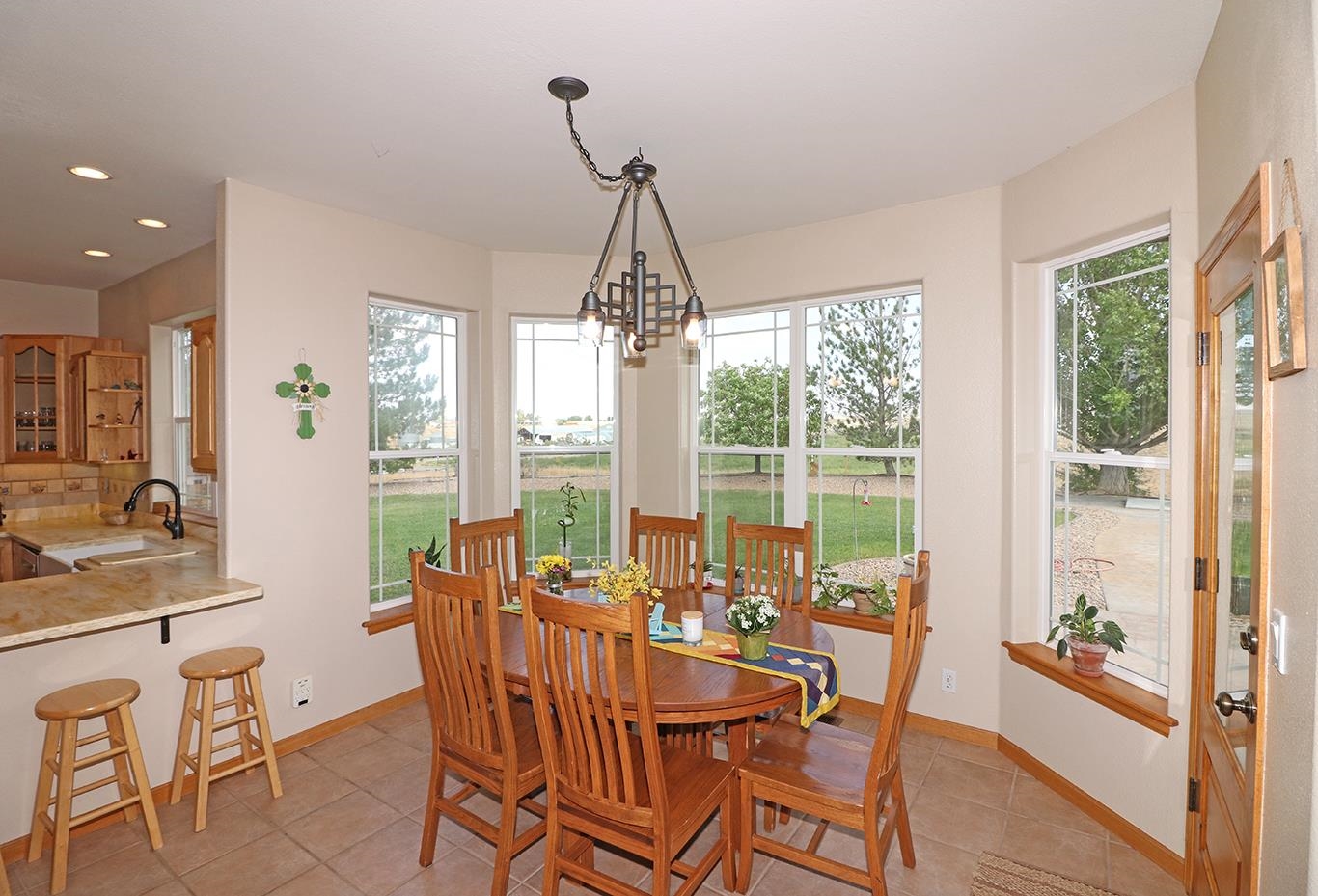 1198 23 Road Grand Junction, CO 81505 - Photo 11 of 32 a dining room with furniture window wooden floor