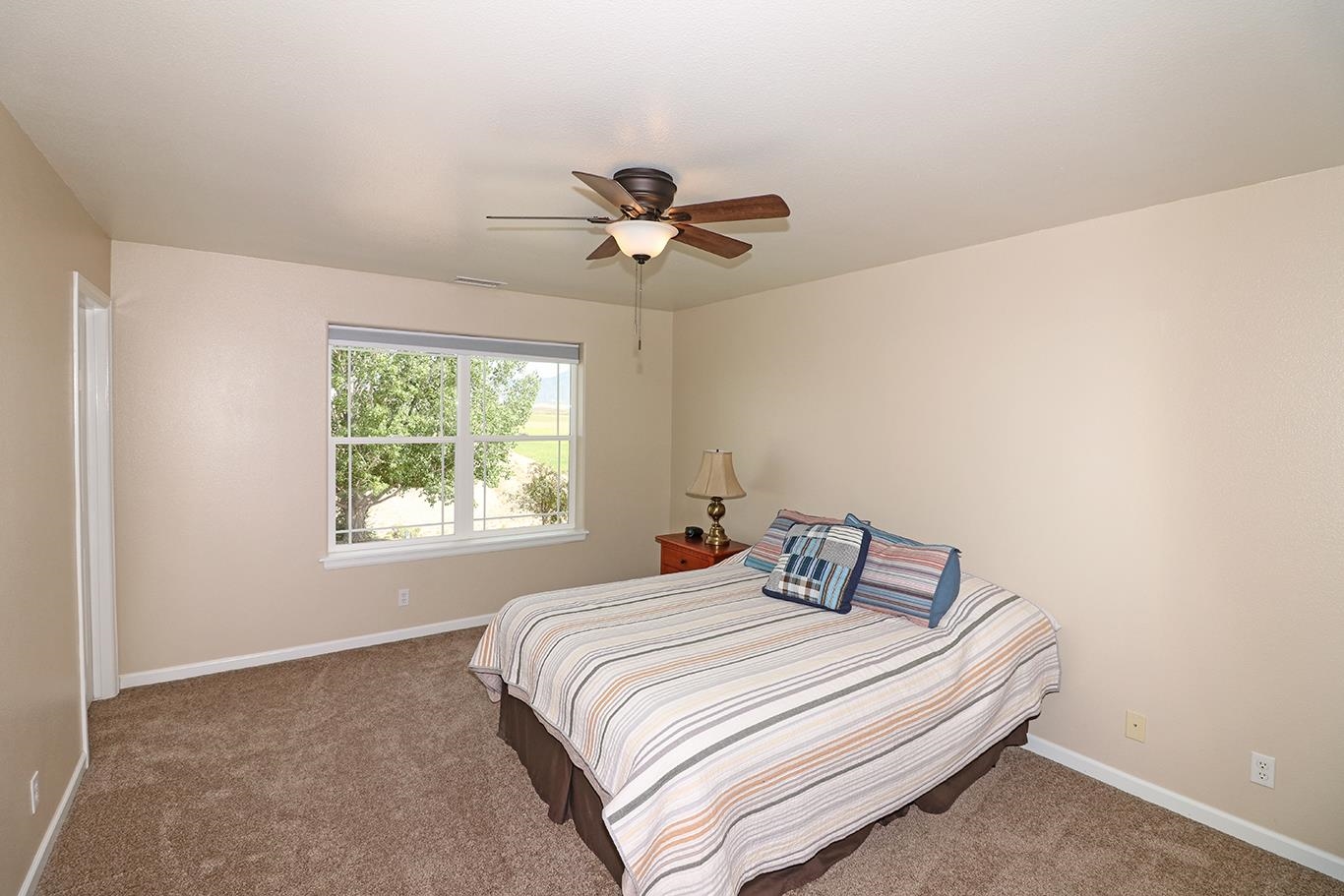 1198 23 Road Grand Junction, CO 81505 - Photo 16 of 32 a bedroom with a bed and window