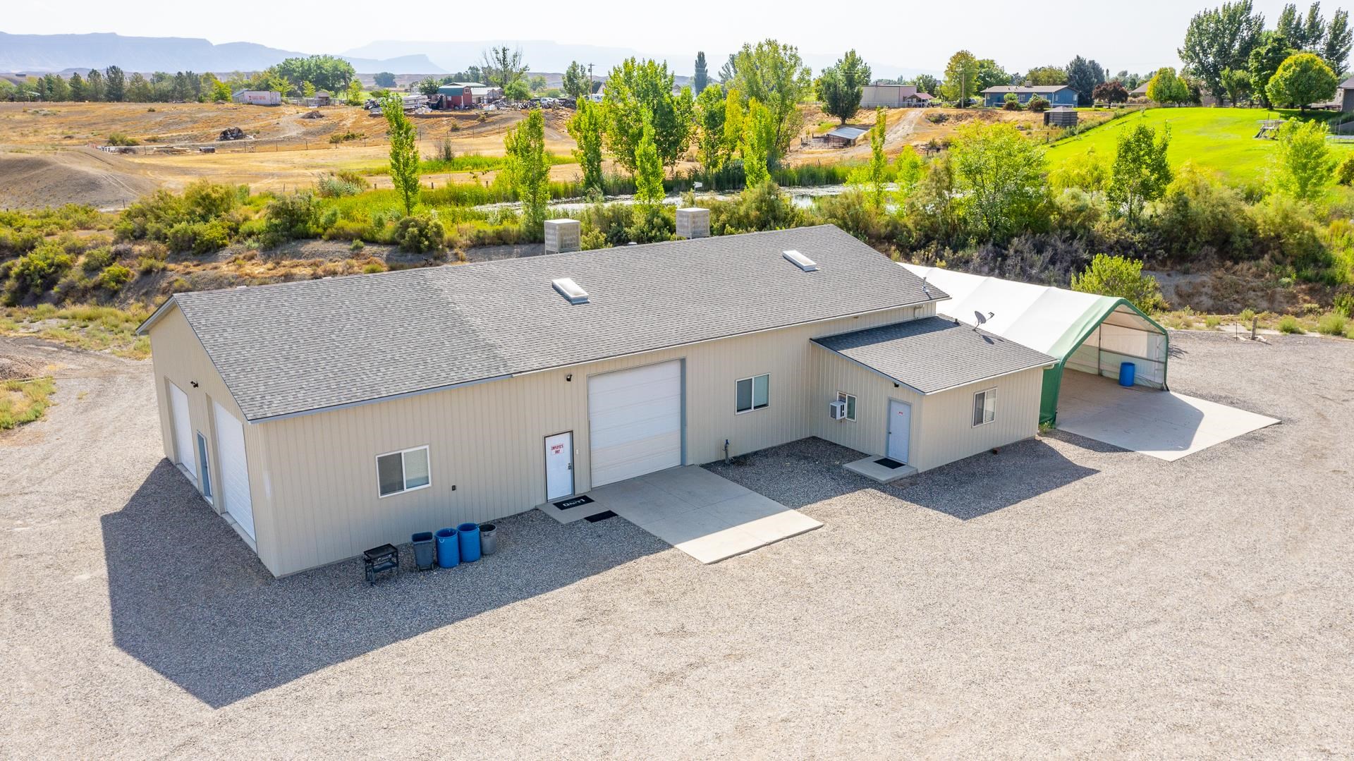 1198 23 Road Grand Junction, CO 81505 - Photo 20 of 32 an aerial view of a house with a yard and lake view