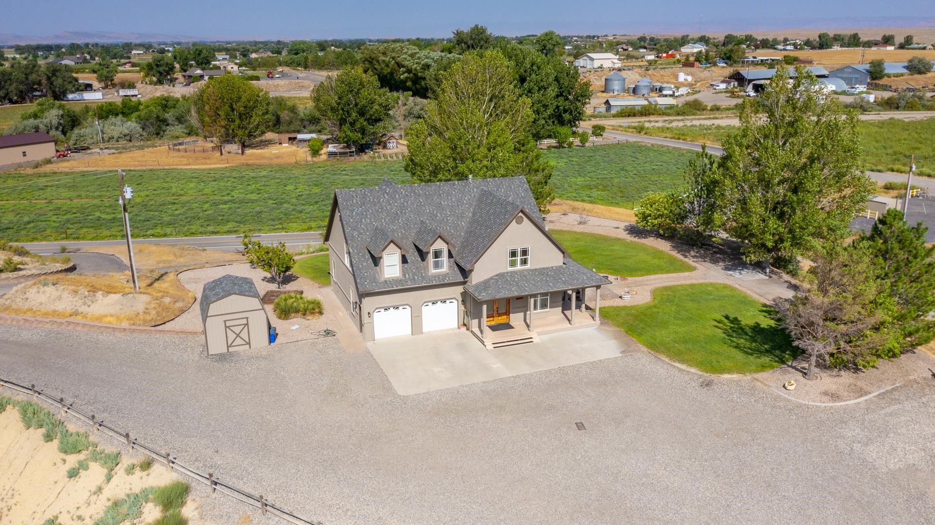 1198 23 Road Grand Junction, CO 81505 - Photo 26 of 32 an aerial view of a house with garden space and outdoor seating