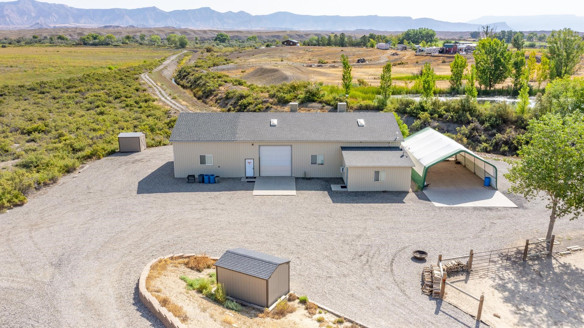 1198 23 Road Grand Junction, CO 81505 - Photo 3 of 32 an aerial view of a house with a lake view