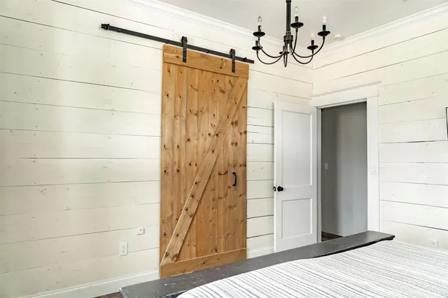 a bathroom with a mirror and a shower